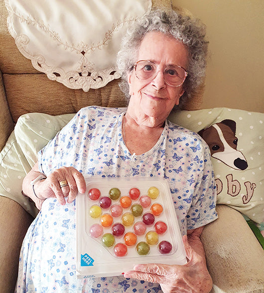 Woman With Dementia Holding Jelly Drops