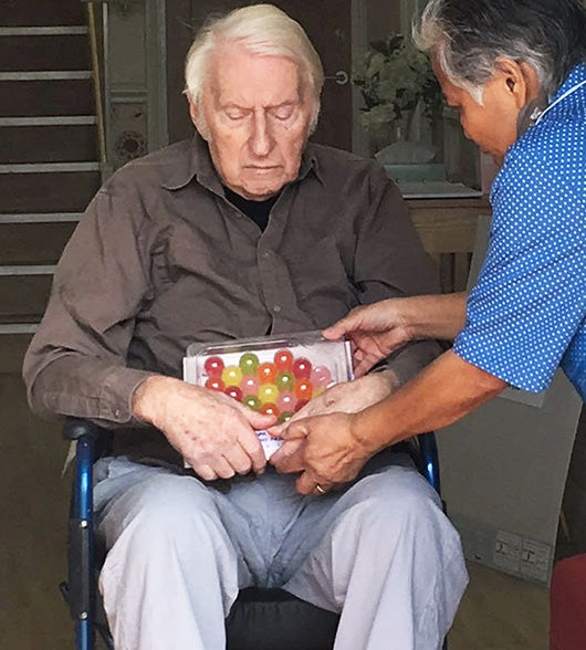 Elderly Man In A Wheel Chair With Jelly Drops